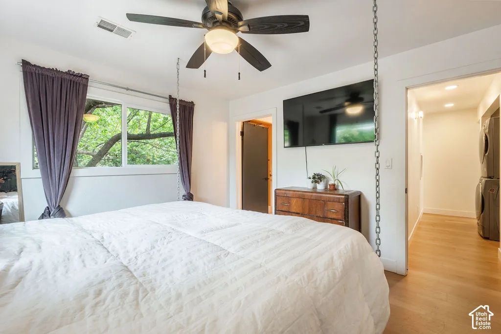 Recessed lighting, wood-finish flooring, and a ceiling fan