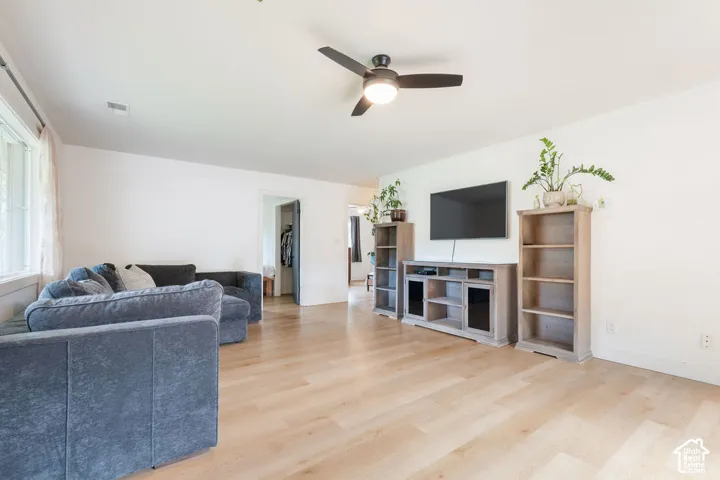 Light wood-finish flooring with white walls