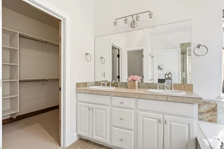 Dual vanity with white cabinetry and brushed nickel hardware