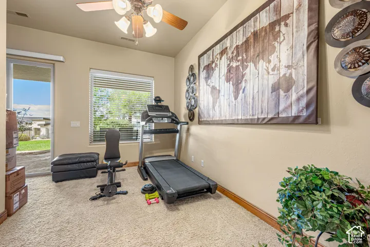 Recessed lighting, ceiling fan, sliding glass door, and a window with blinds