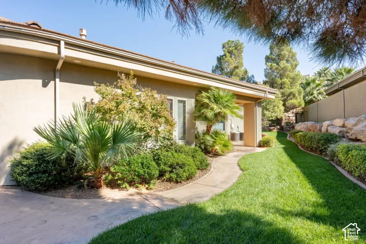 Expansive lawn area with a winding concrete pathway