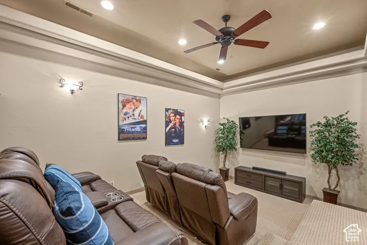 Coffered ceiling with recessed lighting and a ceiling fan
