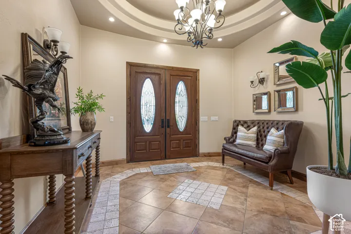 Double wooden entry doors with oval glass inserts
