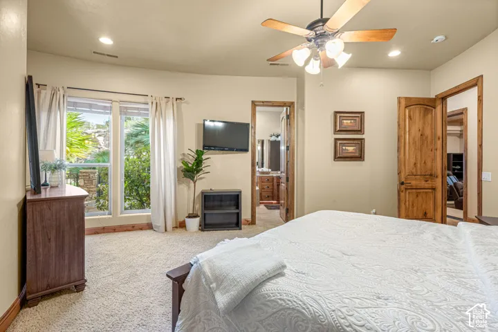 Recessed lighting, ceiling fan with light fixture, wood-finish doors, and plush carpeting