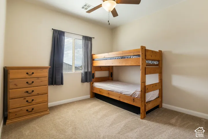 Neutral-toned walls complement plush carpeting