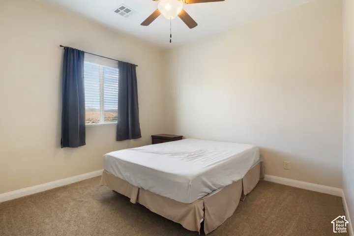 Window with horizontal blinds and drapery rods