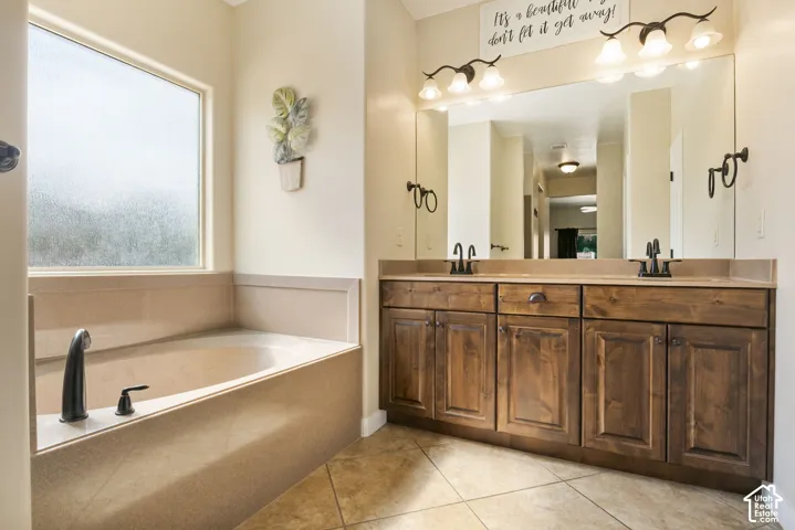 Dual vanity with wood-finish cabinetry and black fixtures