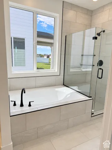 Primary bathroom. Built-in soaking tub and walk in shower