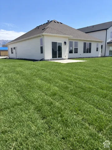 Exterior-featuring full yard landscaping