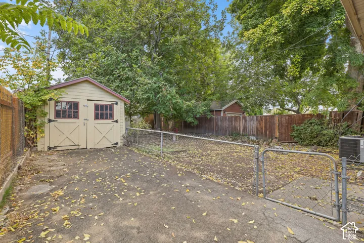 Utility shed with double doors and decorative windows