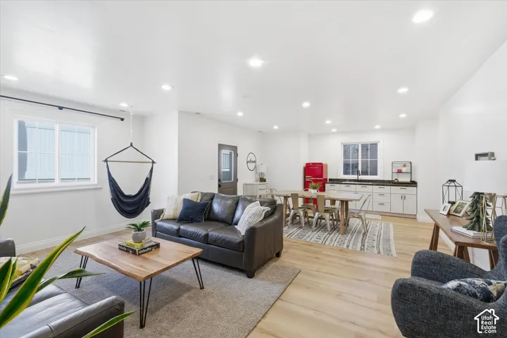 Recessed lighting illuminating wood-finish flooring