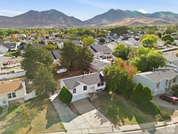 Charming residence situated on a tree-lined lot with mature landscaping and established greenery