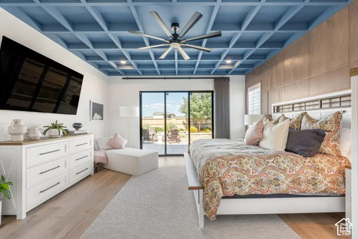 Coffered ceiling, ceiling fan, wood-finish flooring, sliding glass door, and backyard access