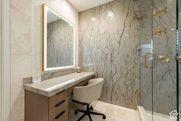 Integrated vanity with a stone countertop and built-in drawers