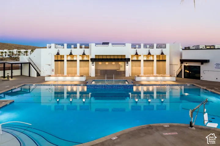 Expansive outdoor swimming pool with integrated spa