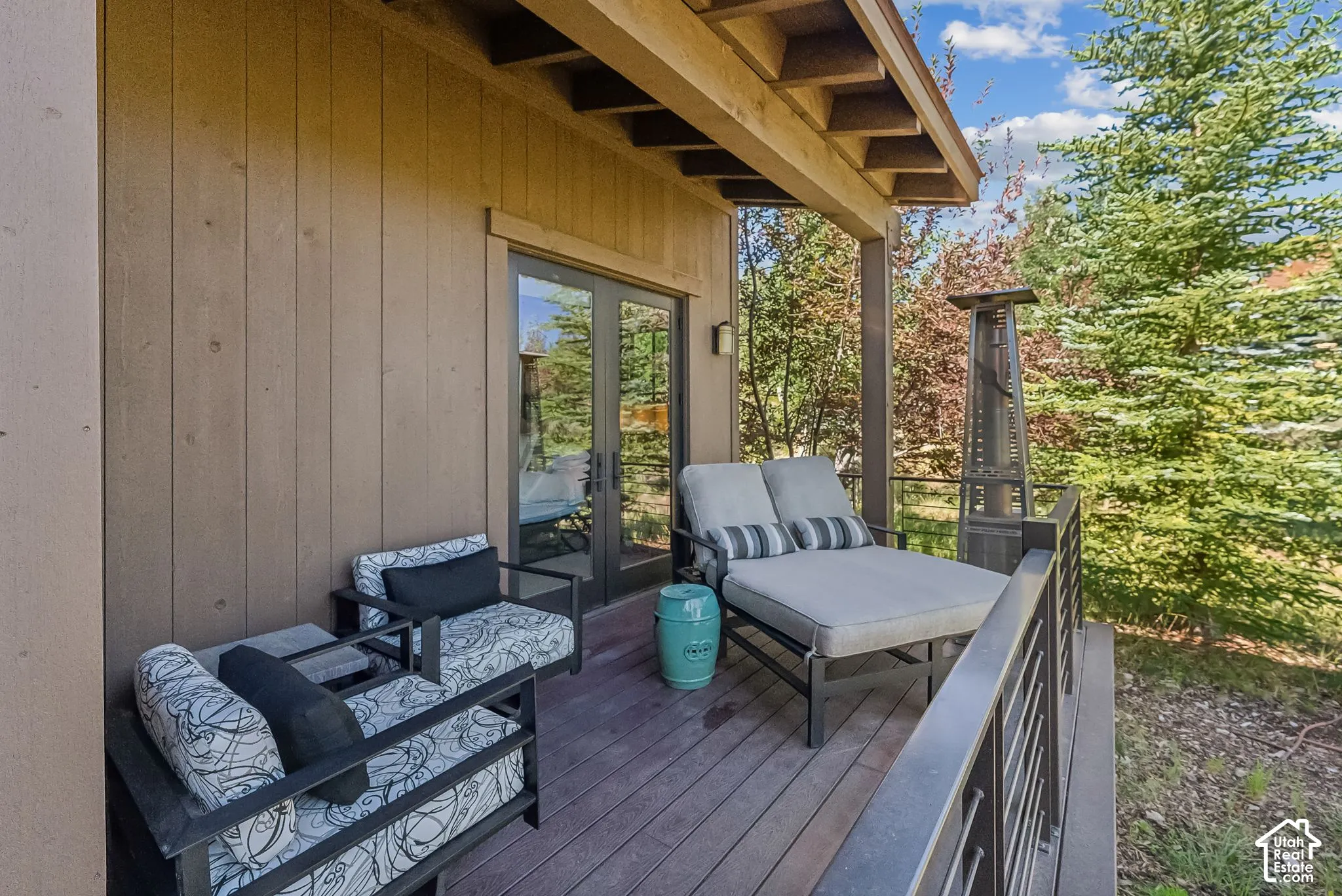 Covered outdoor deck with wood-finish flooring