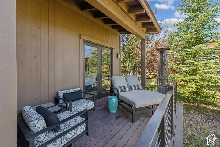 Covered outdoor deck with wood-finish flooring