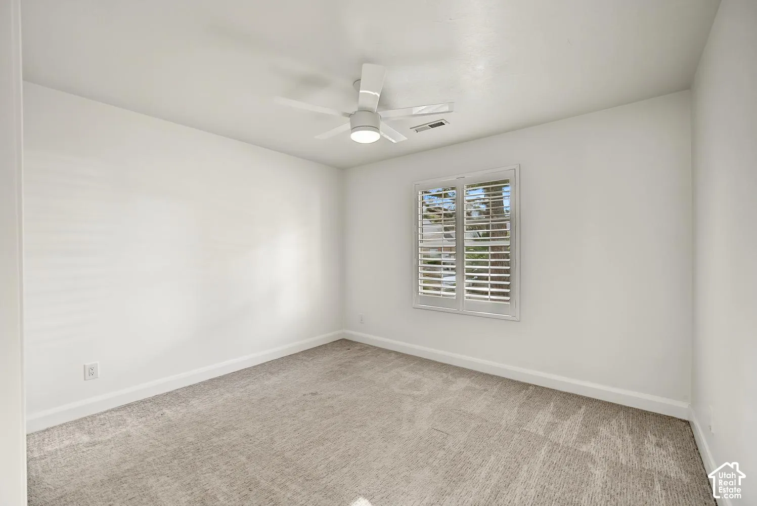 White walls with neutral carpeting