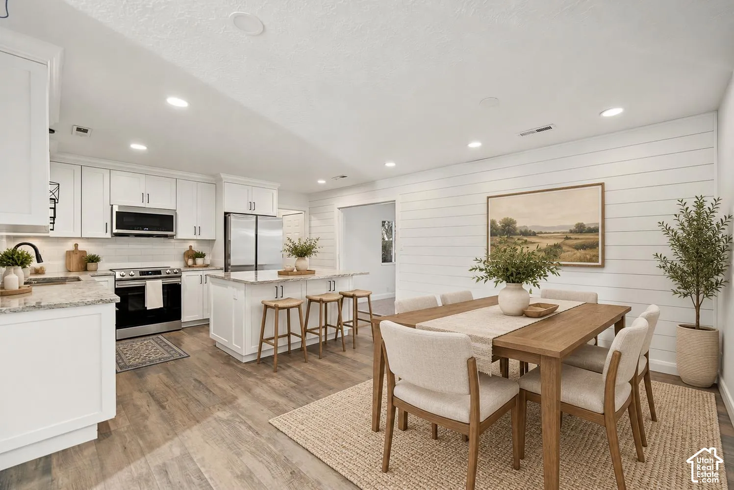 White shaker-style cabinetry with stainless steel hardware
