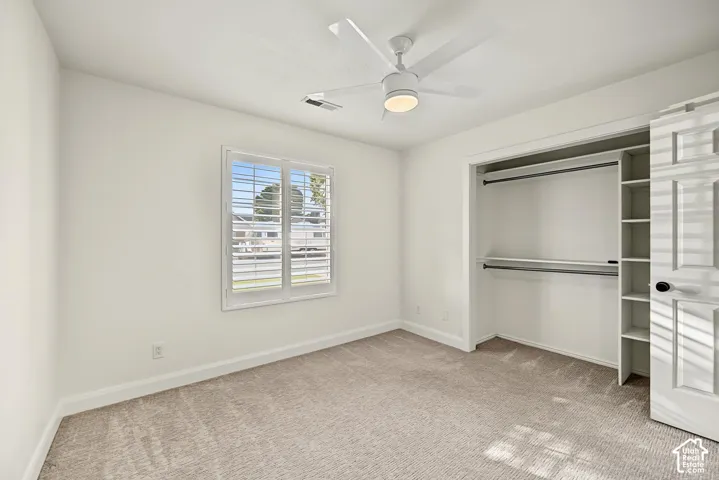 Neutral-toned carpeting with white walls