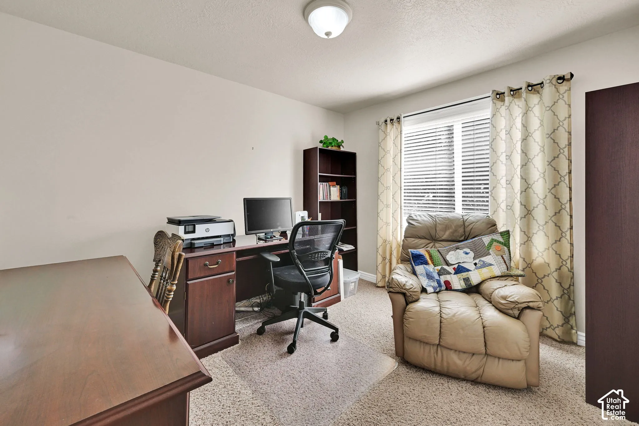Recessed window with white blinds, neutral wall paint, and ceiling-mounted light fixture