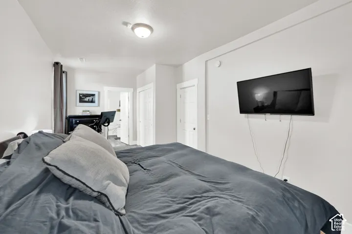 Wall-mounted television with visible wiring
