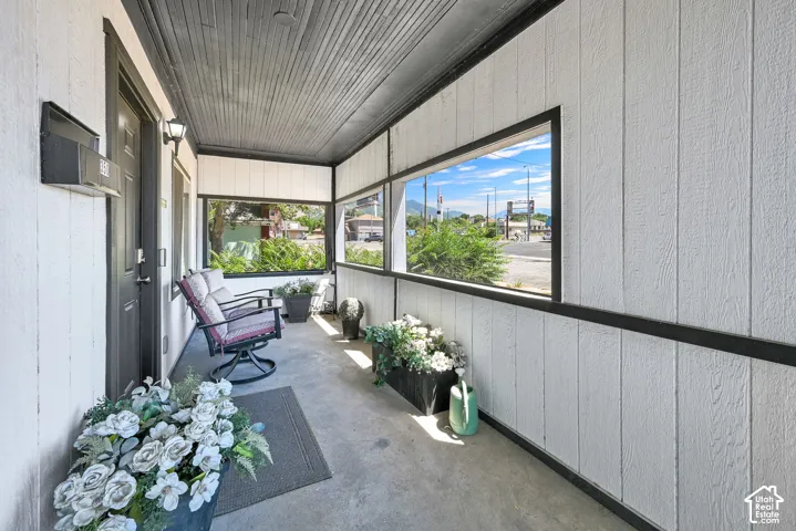 Covered porch with concrete flooring