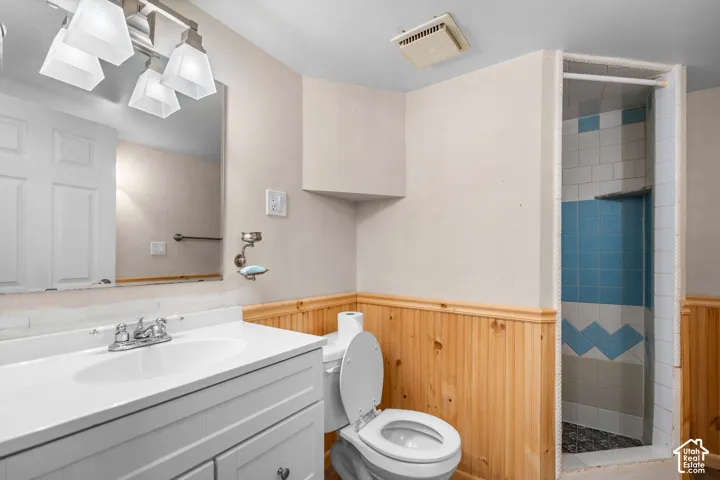 Vanity with integrated sink, chrome faucet, and mirrored medicine cabinet