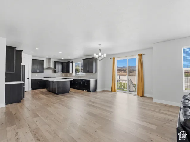 Open-concept living space with wood-finish flooring