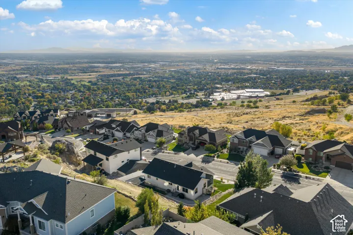 Residential neighborhood with varied home styles and expansive natural surroundings