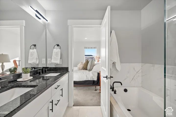 Dual vanity with black granite countertops and integrated sinks