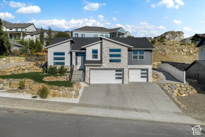 Modern exterior with stone accents and vertical siding