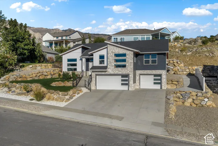 Modern gray siding exterior with stone accents