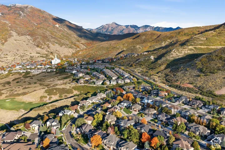 Aerial perspective featuring residential lots nestled within a mountainous landscape and natural terrain