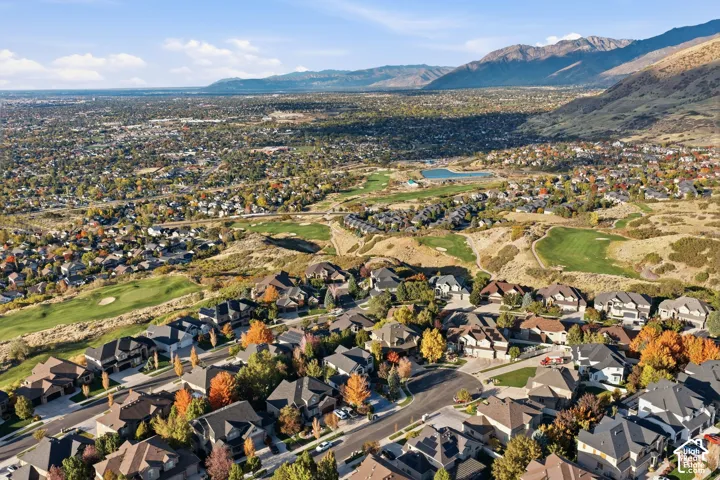 Aerial perspective of a hillside residential community featuring mountain terrain and regional valley topography