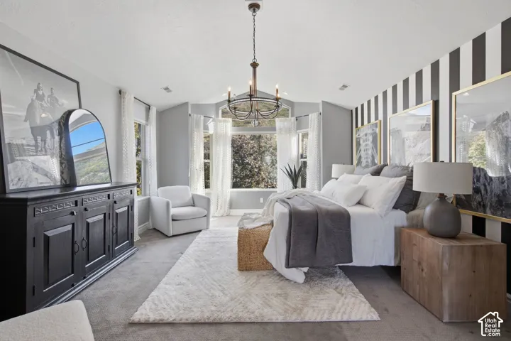 Vaulted ceiling, multi-pane bay window, and wrought iron chandelier
