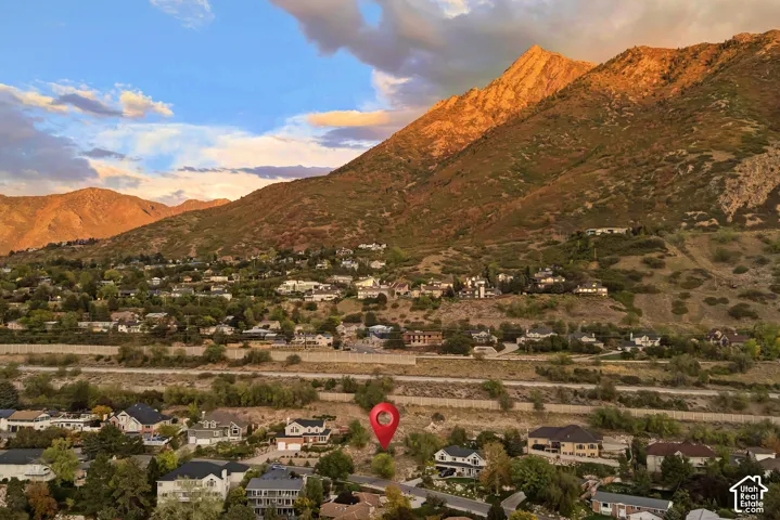 Expansive mountain backdrop with a residential community and diverse architectural styles