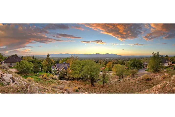 Expansive landscape with a distant mountain range and varied topography
