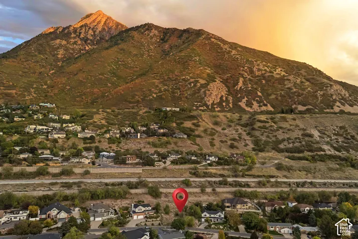 Mountain backdrop with residential properties and roadways