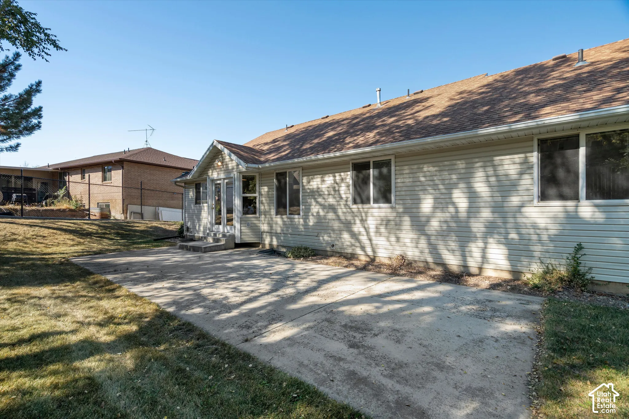 Expansive concrete patio with direct access to the interior