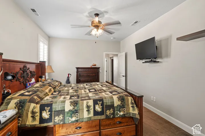 Ceiling fan fixture, recessed lighting, plantation shutters, wood-finish flooring, and a wall-mounted media shelf