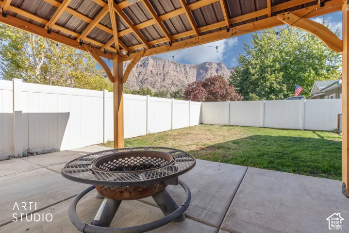 Covered patio with a metal roof and exposed wood beams
