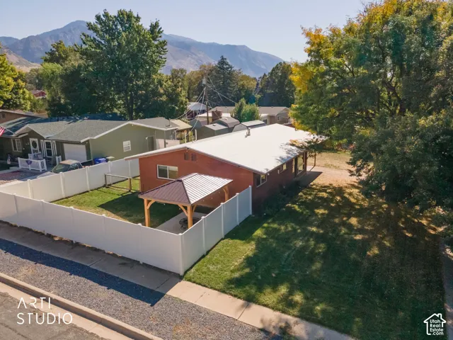 Red brick exterior with a white metal roof
