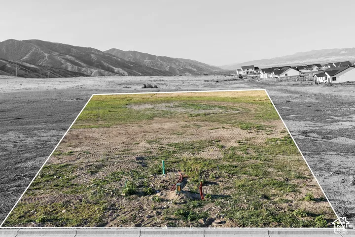Level parcel featuring utility hookups and mountain surroundings