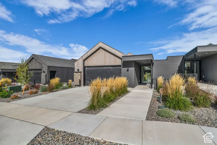 Contemporary architectural style featuring wood and dark-toned siding
