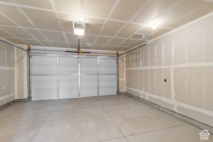 Concrete flooring with a segmented overhead door