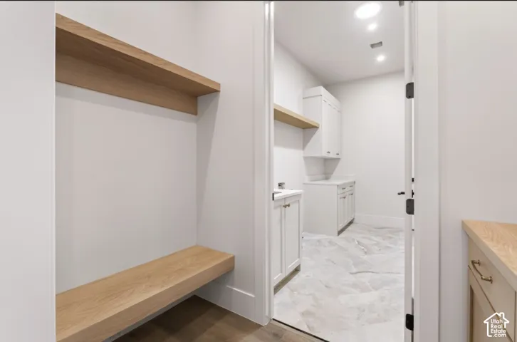 Built-in bench with floating wood-finish shelving