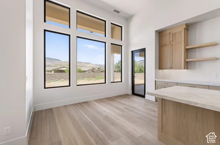 High ceilings with an array of black-framed windows and transom windows