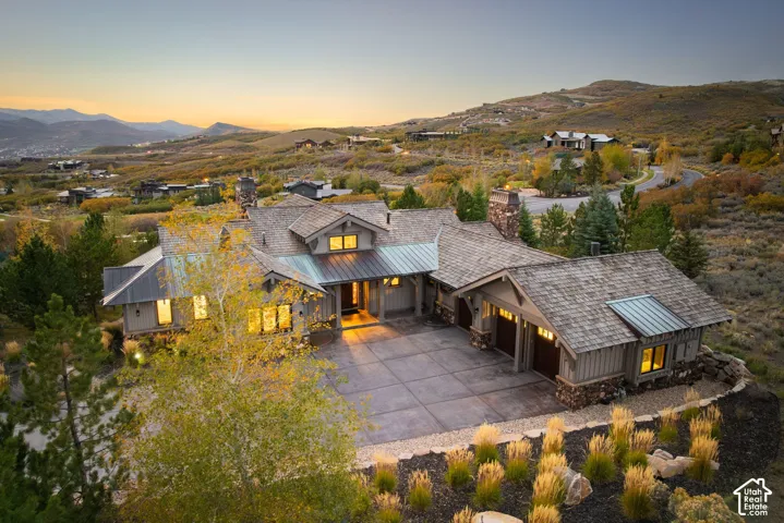 Craftsman-style residence with a multi-gabled roof and stone accents