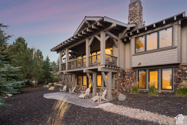 Stone and shingle exterior with a prominent stone chimney
